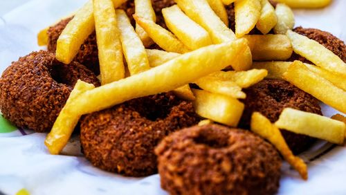 Close-up of burger and fries on plate