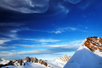 View of snowcapped mountain against blue sky