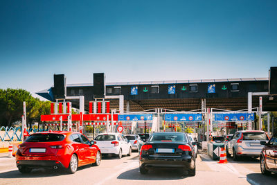 Cars on road against clear sky