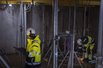 Engineer at building site using digital tablet