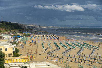 High angle view of beach and buildings against sky