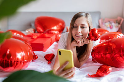 Portrait of woman using mobile phone