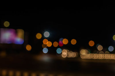 Defocused image of illuminated lights at night