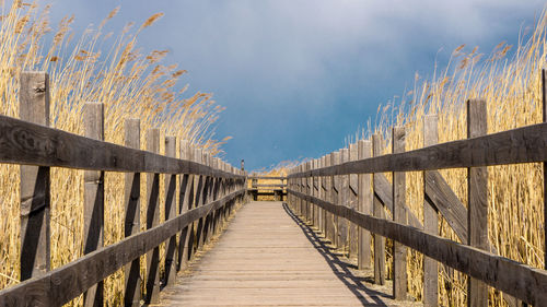 View of footbridge against sky