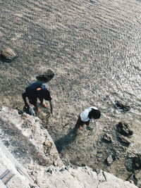 High angle view of people on rocks