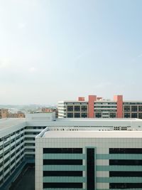Modern buildings in city against sky