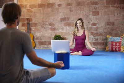 Girl doing yoga classes online