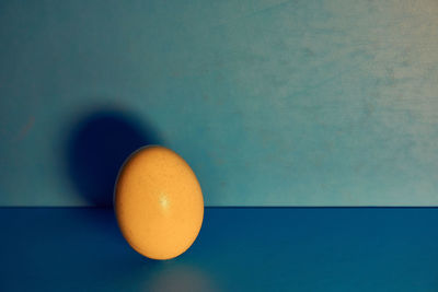 Close-up of orange on blue table