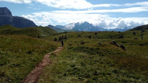 Scenic view of green landscape and mountains