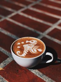 Close-up of cappuccino on table