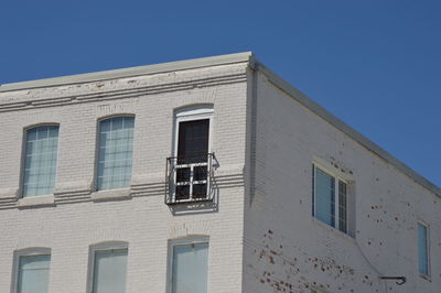 Low angle view of building against blue sky