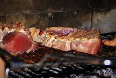 Tuna fillets grilling on barbecue