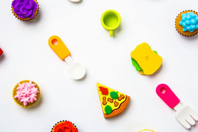 High angle view of multi colored candies on table