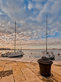 Boats moored at harbor