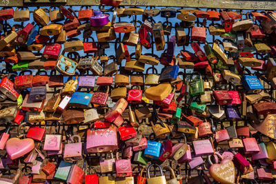 Full frame shot of padlocks hanging on railing