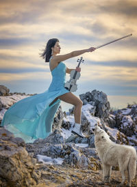 Woman standing on land against sky