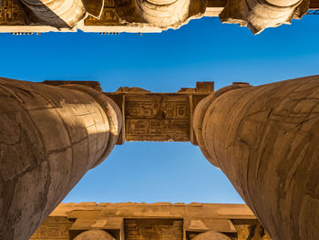 Low angle view of historical building against blue sky