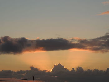 Scenic view of silhouette trees against sky at sunset