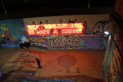 Graffiti on wall at night