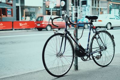 Bicycle parked at roadside