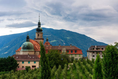 Old monastery with apple trees garden. tirol, south tyrol.