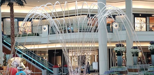 Low angle view of lanterns hanging in shopping mall