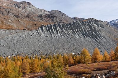 Scenic view of glacier moray against sky during autumn