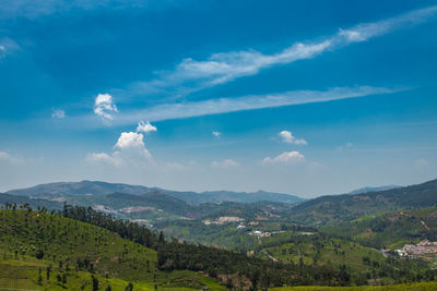 Tea gardens in the foothills of western ghat with bright blue sky