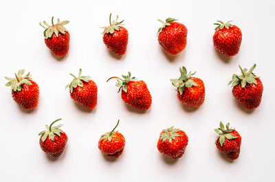 High angle view of strawberries on white background