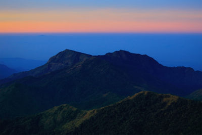 Scenic view of mountains against sky during sunset