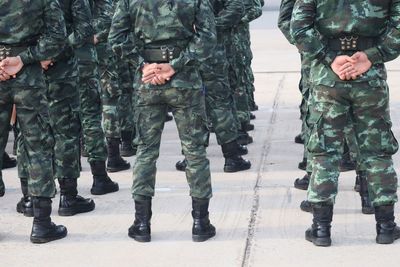 Low section of soldiers standing outdoors