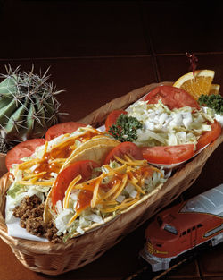 Close-up of fruit salad in basket on table