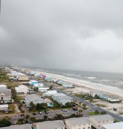 Panoramic view of sea and buildings against sky