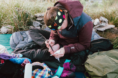 High angle view of couple sitting on land