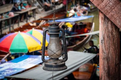 Close-up of lantern hanging at market stall