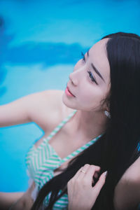 Beautiful woman relaxing in swimming pool