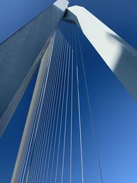 Low angle view of bridge against clear blue sky