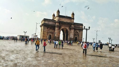 Group of people in front of historical building