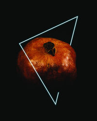 Close-up of apple against black background