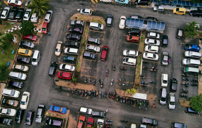 High angle view of car park by buildings