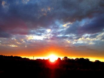 Scenic view of dramatic sky during sunset