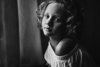 Portrait of girl sitting at home