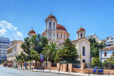 View of buildings against blue sky