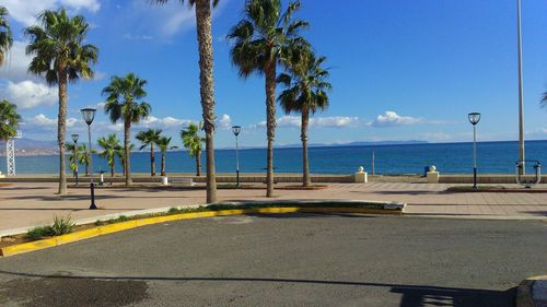 Scenic view of beach against clear blue sky