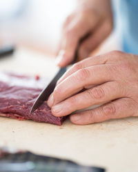 Cropped image of man working on table