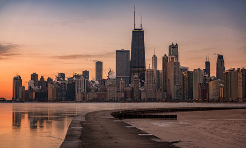 View of chicago by lake michigan at sunset
