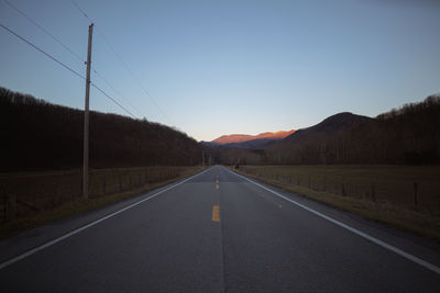 Empty road against clear sky