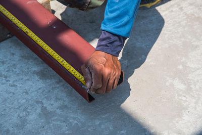 Low section of man wearing shoes