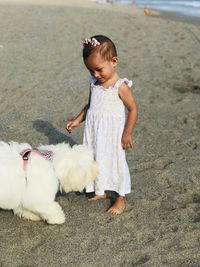 Full length of cute girl lying on land