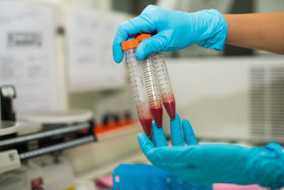 Cropped hands of scientist experimenting in laboratory